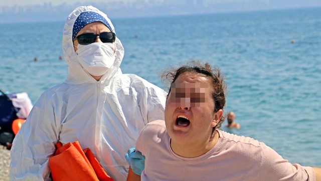 Karantinayı delen koronavirüslü kadın, sahilde 